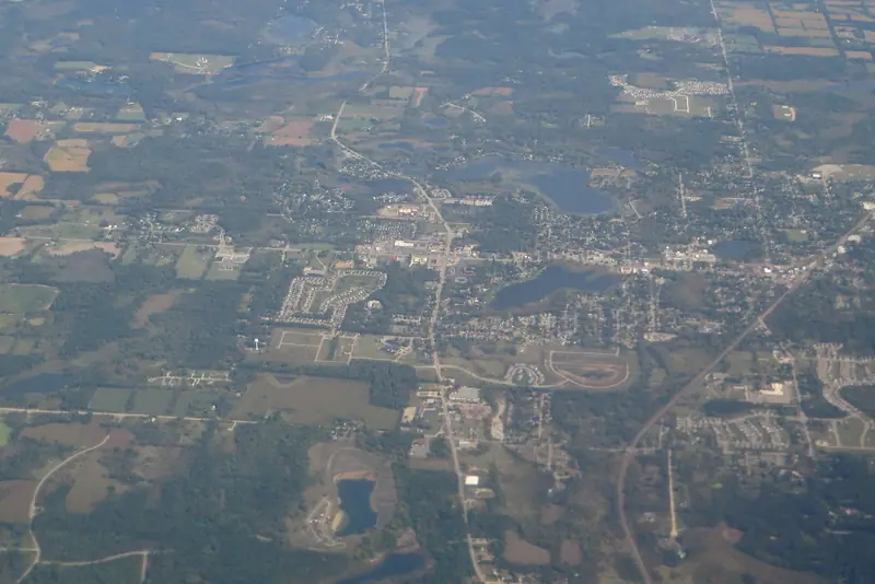 Holly from the air: fields, woodlots and lakes on the Genesee County line.